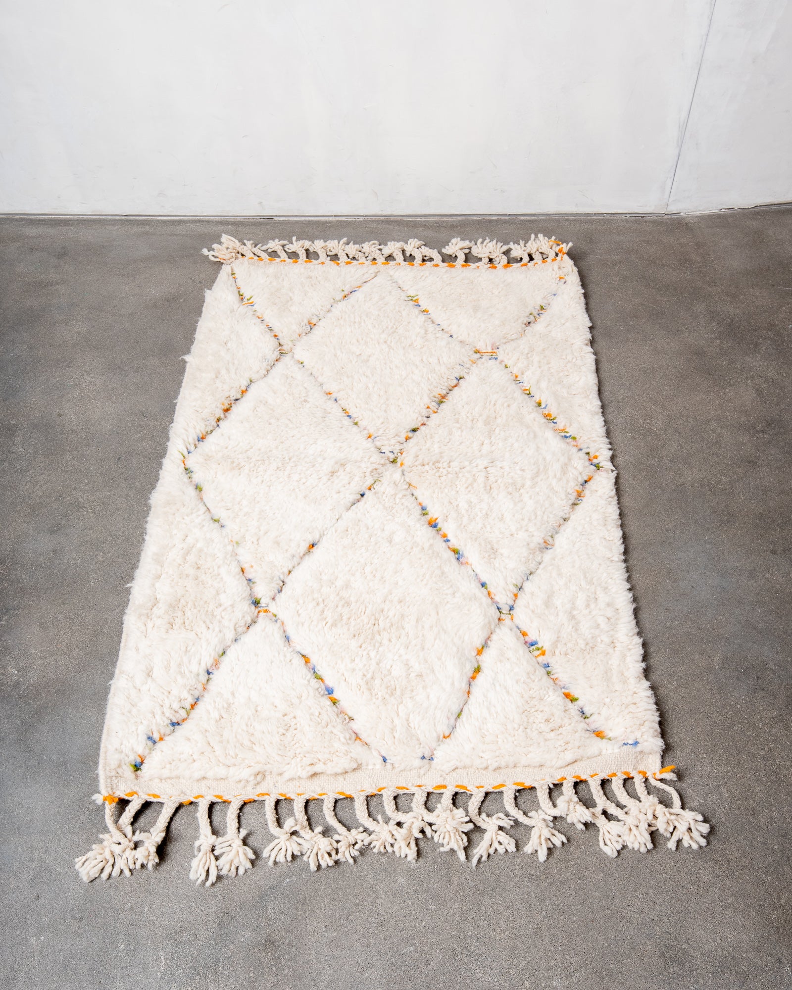 Modern, designer, handcrafted Berber rug from Morocco. Beniourain carpet with beautiful colours and patterns and fluffy wool texture.